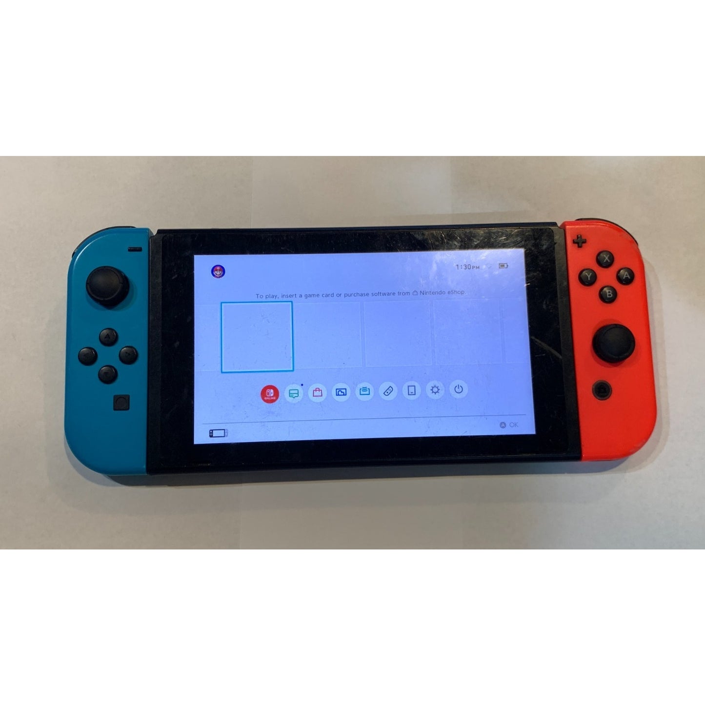 Nintendo Switch 32GB Handheld Console w/ Red & Blue Joycon