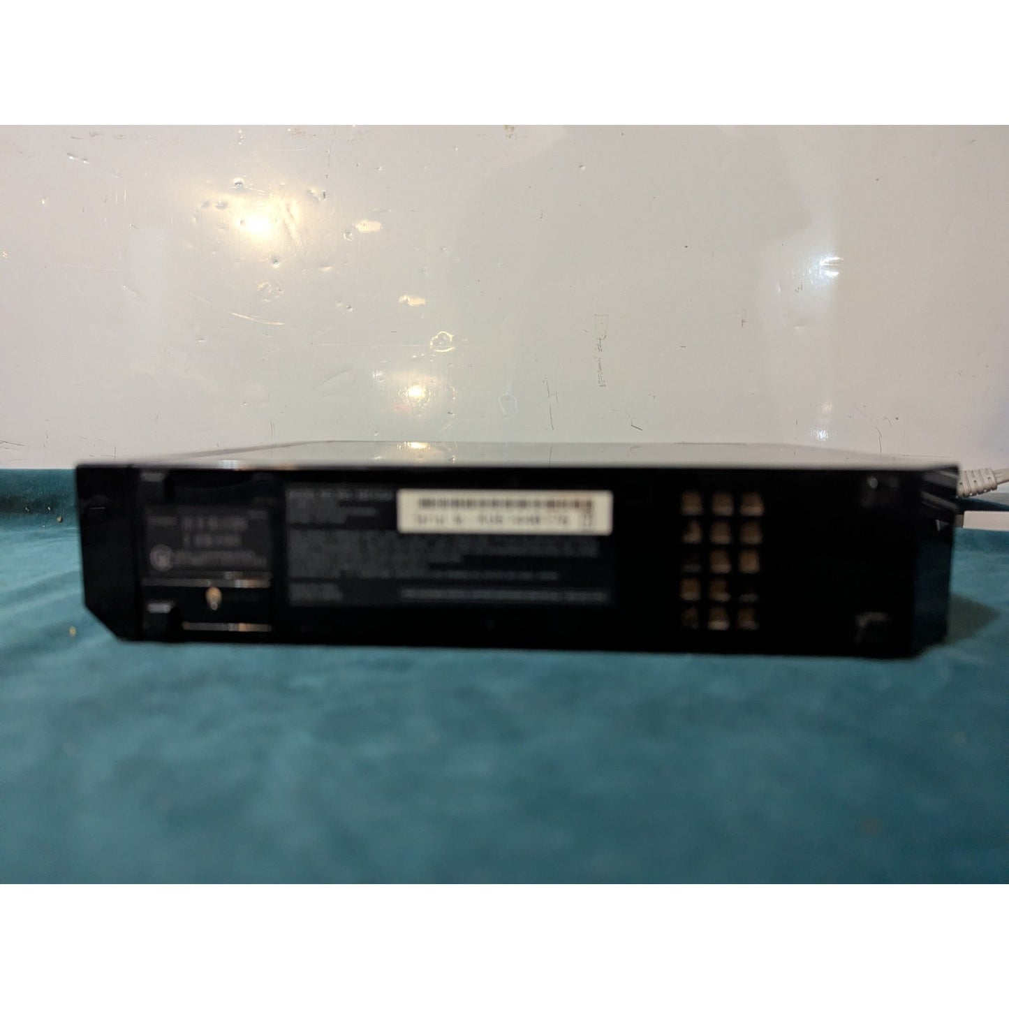 Nintendo Wii Black Video Game Console with Wires and Controller.