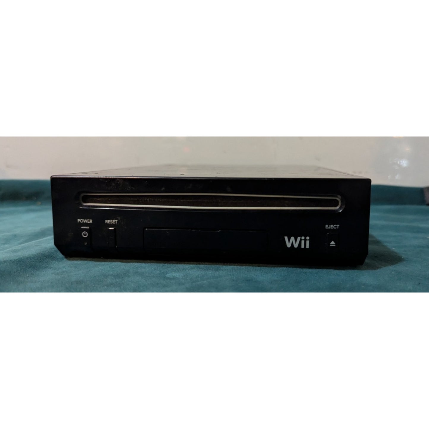 Nintendo Wii Black Video Game Console with Wires and Controller.