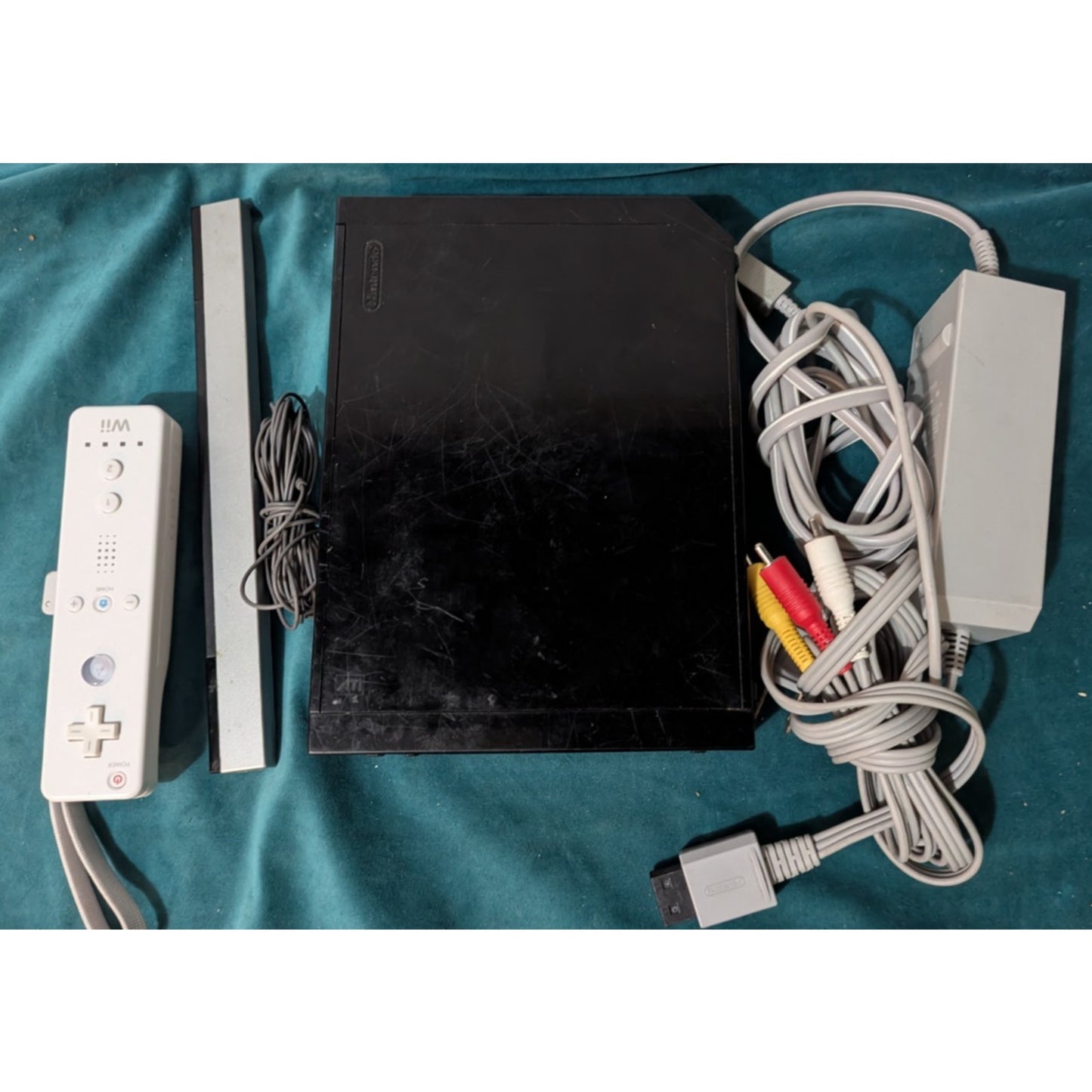 Nintendo Wii Black Video Game Console with Wires and Controller.